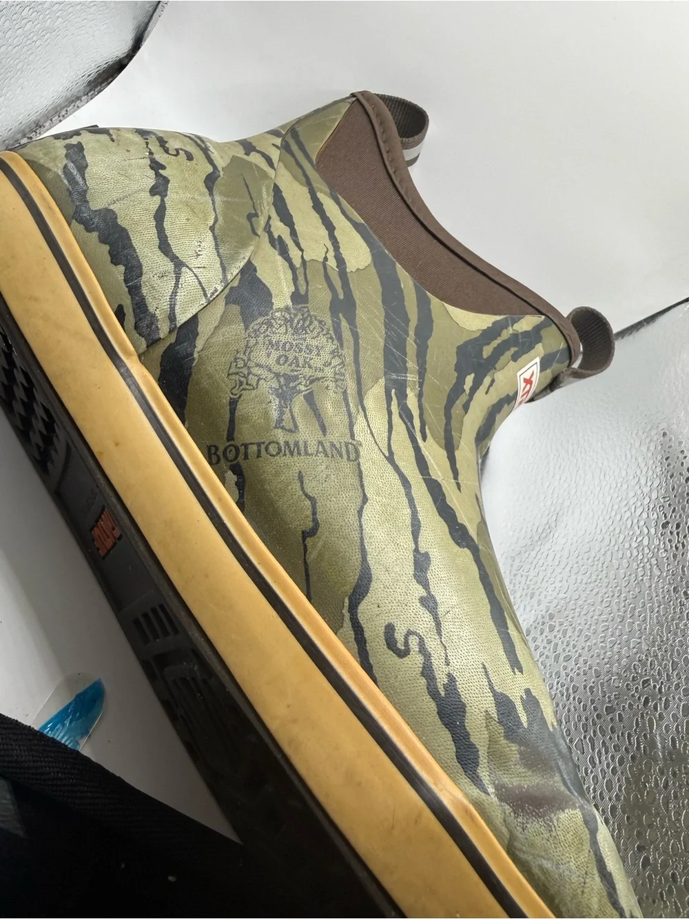 Men’s These are the XTRATUF Men's Mossy Oak Bottomland Ankle Deck Boots, featuri
